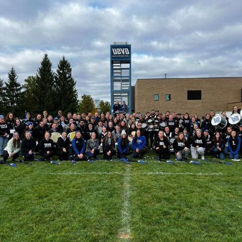 Laker Marching Band Alumni pose for a photo during Homecoming 2023