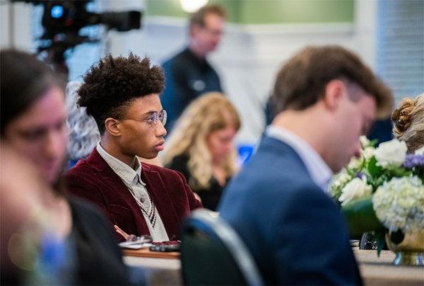 A GVSU student listens to Bror Saxberg speak at the President's Forum on October 25.